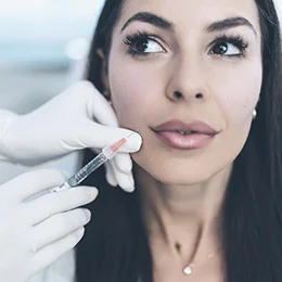  Woman receiving a facial injection.