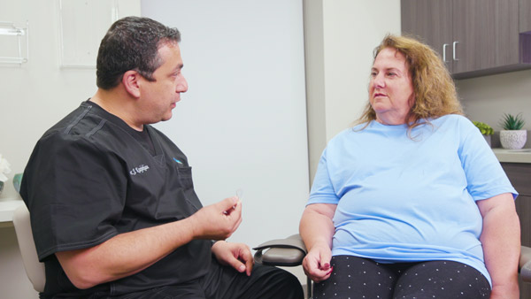 Dr. Krajekian discusses chin implant options with a patient at The Facial Center in Charleston, WV
